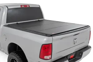 Rough Country - 49319550 | Rough Country Hard Tri-Fold Flip Up Tonneau Bed Cover For Ram 1500 (2009-2018) / 1500 Classic (2019-2023 | 5' 7" Bed Without RamBox Storage