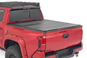 Rough Country - 49415551 | Rough Country Hard Tri Fold Flip Up Bed Cover For Toyota Tacoma 2/4WD (2024-2024) | 5' Bed