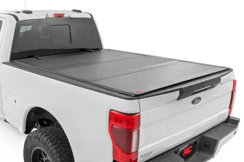 Rough Country - 49220651 | Rough Country Hard Tri-Fold Flip Up Tonneau Bed Cover For Ford F-250/F-350 Super Duty | 2017-2023 | 6'10" Bed