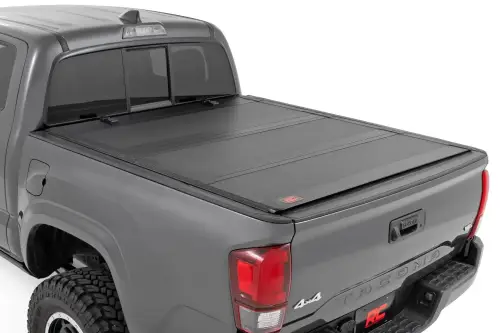 Rough Country - 49420500 | Rough Country Hard Tri Fold Flip Up Bed Cover For Toyota Tacoma | 2016-2023 | 5' Bed