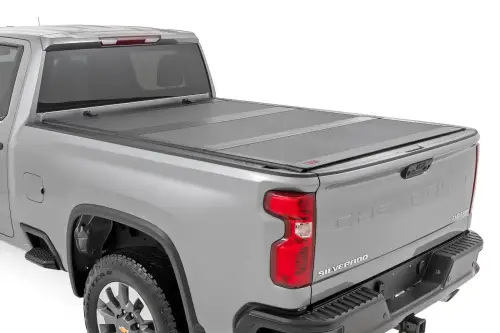 Rough Country - 49120651 | Rough Country Hard Tri-Fold Flip Up Tonneau Bed Cover For Chevrolet Silverado 2500/3500 HD / GMC Sierra 2500/3500 HD | 2020-2024 | 6'9" Bed