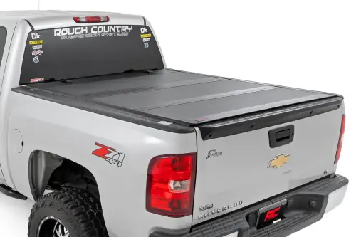 Rough Country - 49113551 | Rough Country Hard Tri-Fold Flip Up Tonneau Bed Cover For Chevrolet Silverado 1500 / GMC Sierra 1500/1500 Denali (2007-2013) | 5' 9" Bed With Rail Caps