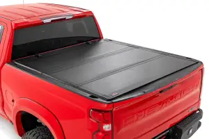 49120580 | Rough Country Hard Tri-Fold Flip Up Tonneau Bed Cover For Chevrolet Silverado 1500 / GMC Sierra 1500 | 2019-2023 | 5' 10" Bed